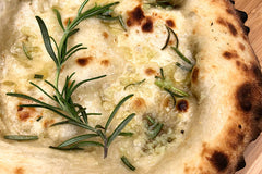 Garlic bread covered with rosemary and butter baked using a rosemary garlic bread recipe