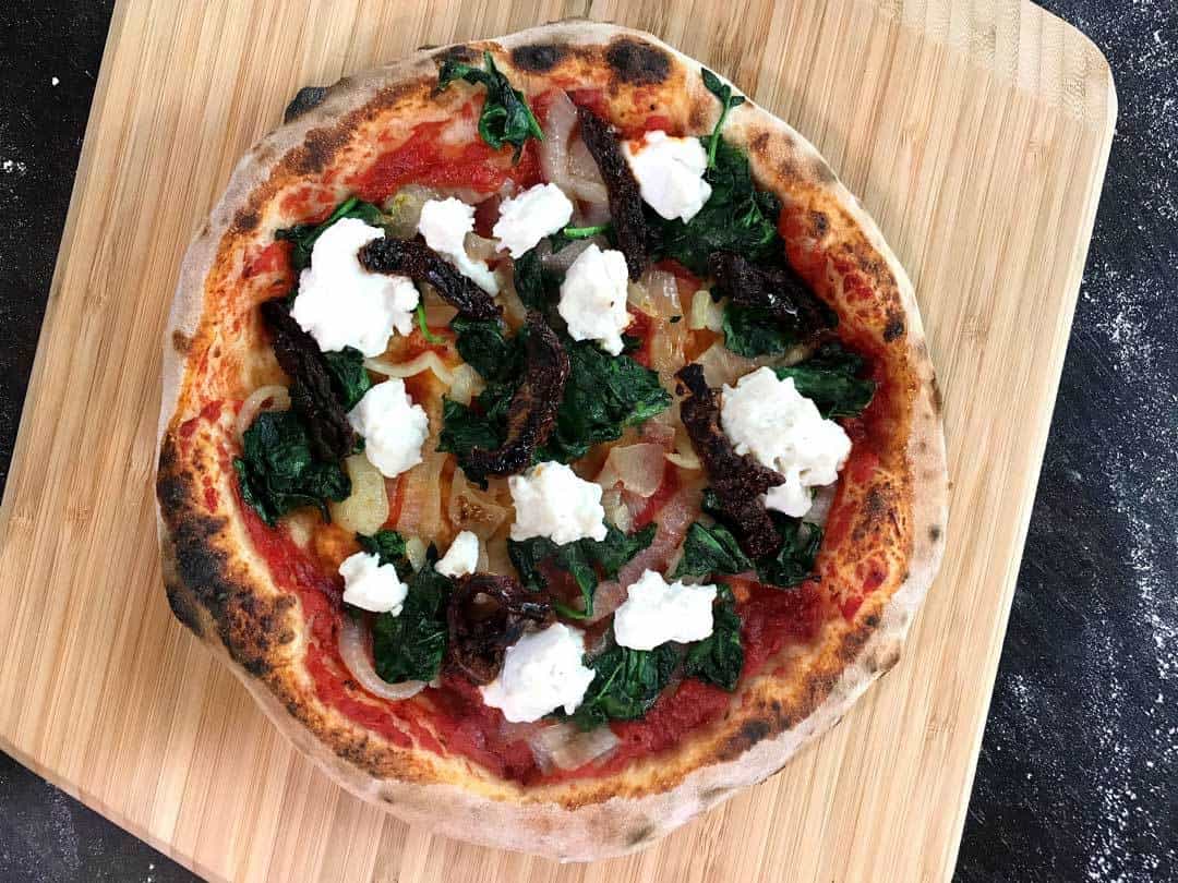 Vegan Ricotta, Spinach &amp; Caramelised Onion Pizza — Ooni New Zealand