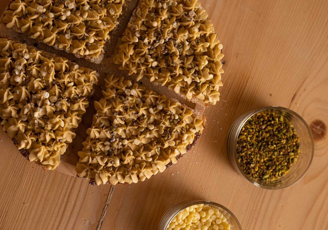 Sweet Pistachio and White Chocolate Pizza on a wooden counter top