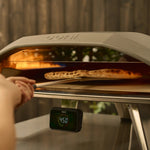 wide turning peel turning pizza in oven 