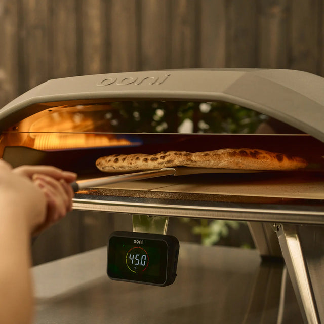 wide turning peel turning pizza in oven 