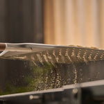 flour dropping through holes in the ooni signature pizza peel 
