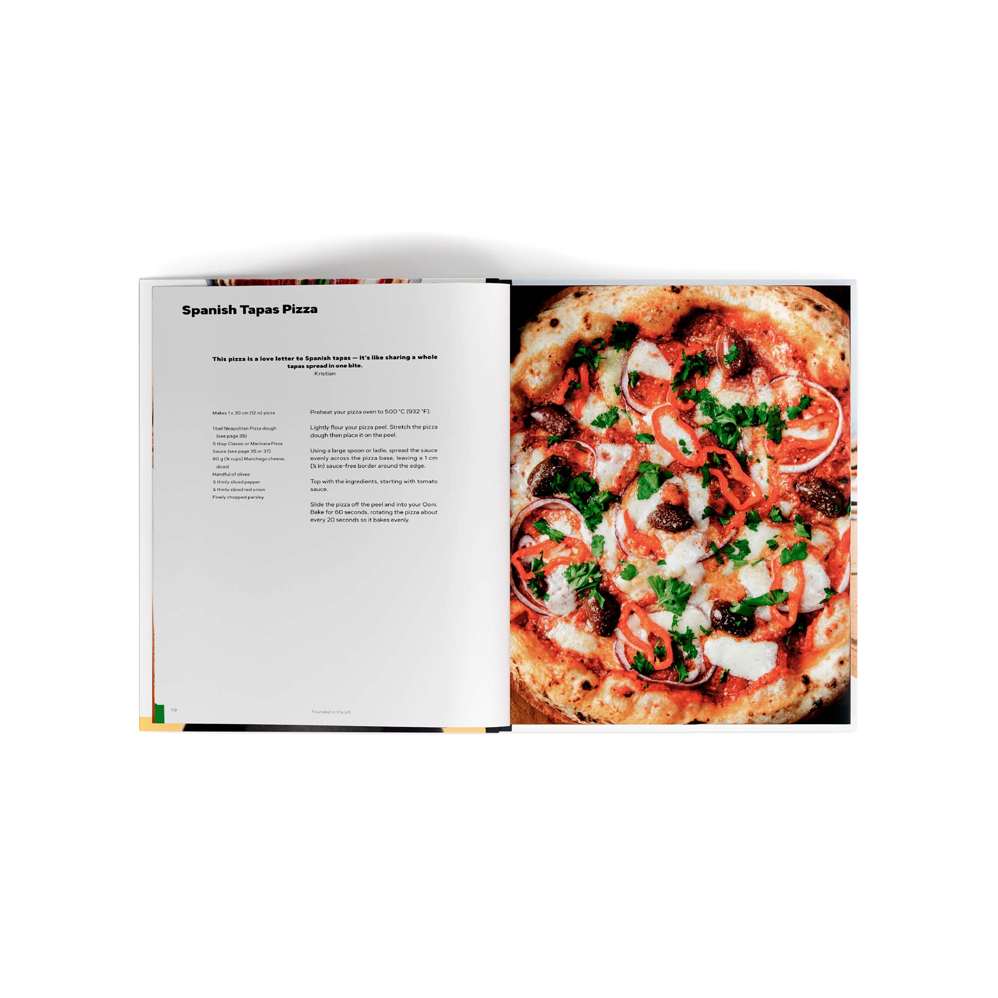 Cooking with Ooni Cookbook open to page with Spanish Tapas Pizza recipe.