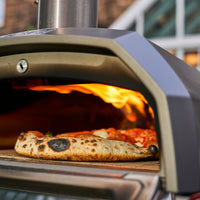 Close up of pizza being cooked in the Karu 12G Pizza Oven