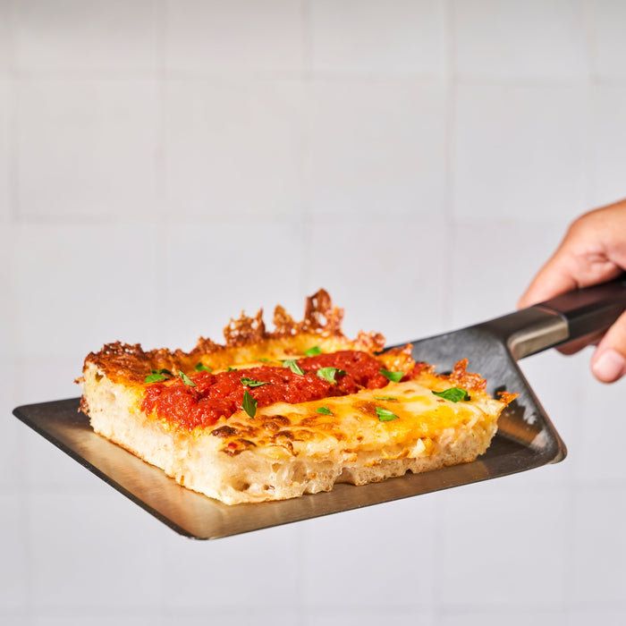 Detroit-Style Pizza on Ooni Pan Pizza Spatula | Click this image to open up the product gallery modal. The product gallery modal allows the images to be zoomed in on.
