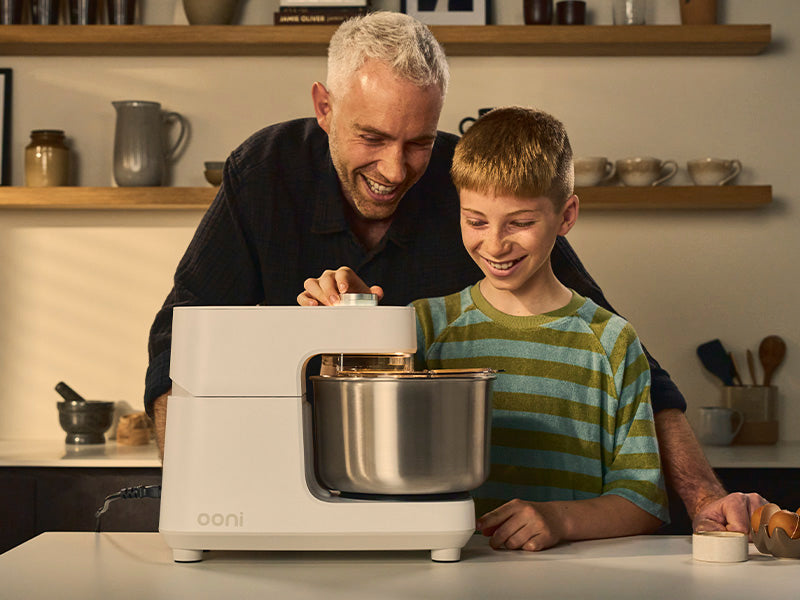 family using the Ooni Halo Core on the counter in polar white