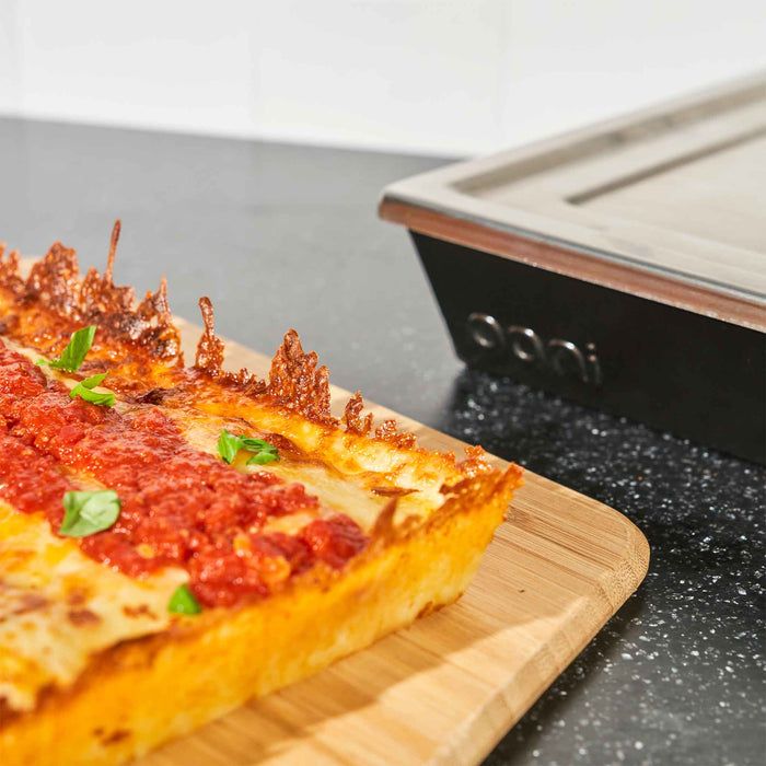 9x6 Detroit-Style Pizza Pan (small) with Detroit-Style Pizza | Click this image to open up the product gallery modal. The product gallery modal allows the images to be zoomed in on.