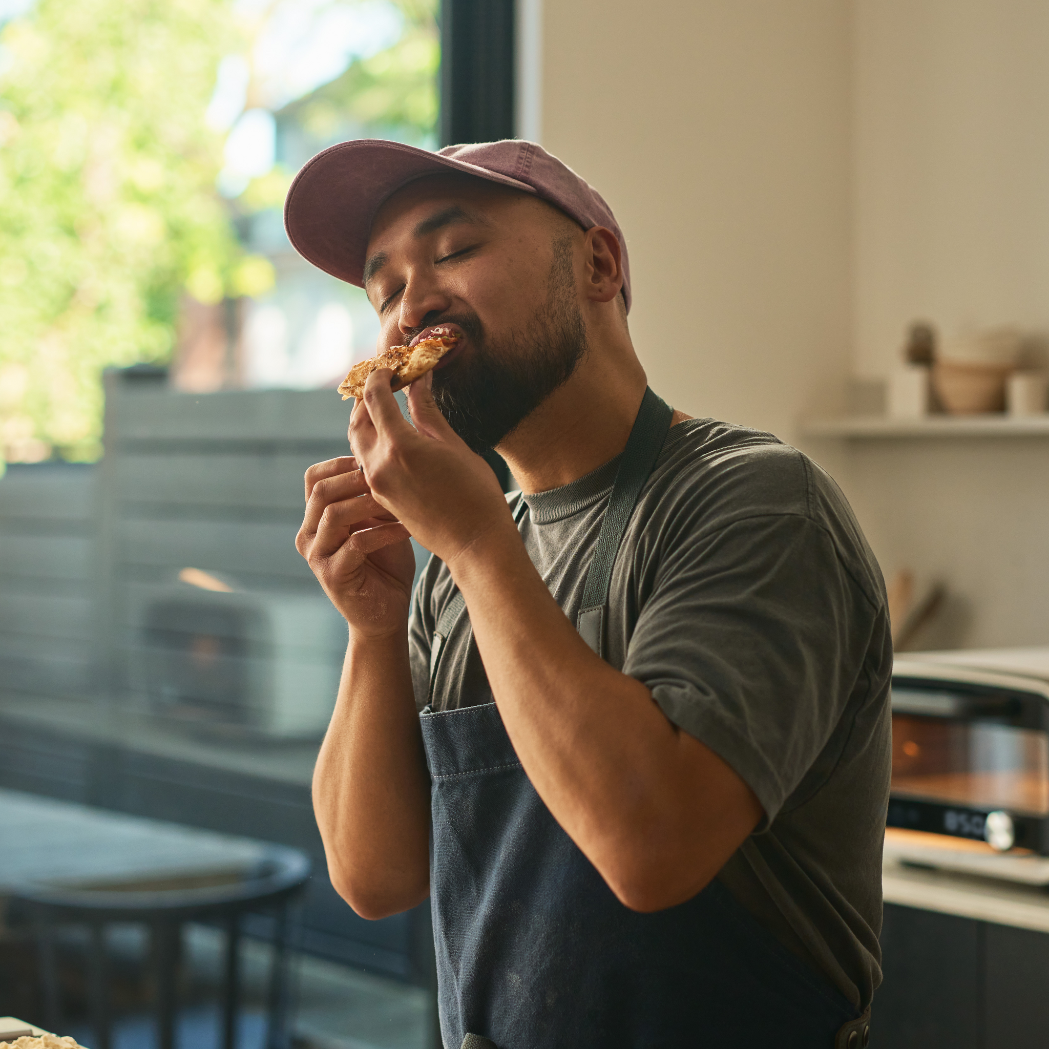 person eating pizza infront of volt 2 