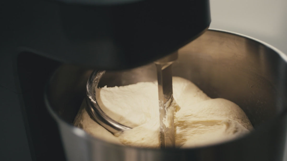 Ooni Halo Core Spiral Mixer with dough hook and breaker bar showing dough not sticking to it. 